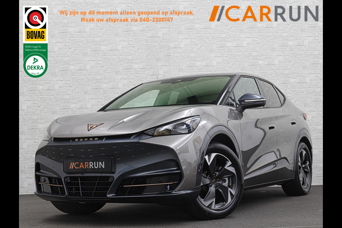 CUPRA Tavascan 77 kWh | Nieuw! | Winter-Pack | Warmtepomp | Verlengde Fabrieksgarantie | 7x Op Voorraad | Adaptive Cruise Control | 3-Zone Clima | Verwarmde Voorruit | Keyless-Entry | Sfeerverlichting | Stoelverwarming | Carplay | Stuurverwarming | Getint Glas | 19 inch | Lane-Assist | Camera | Draadloos Laden |