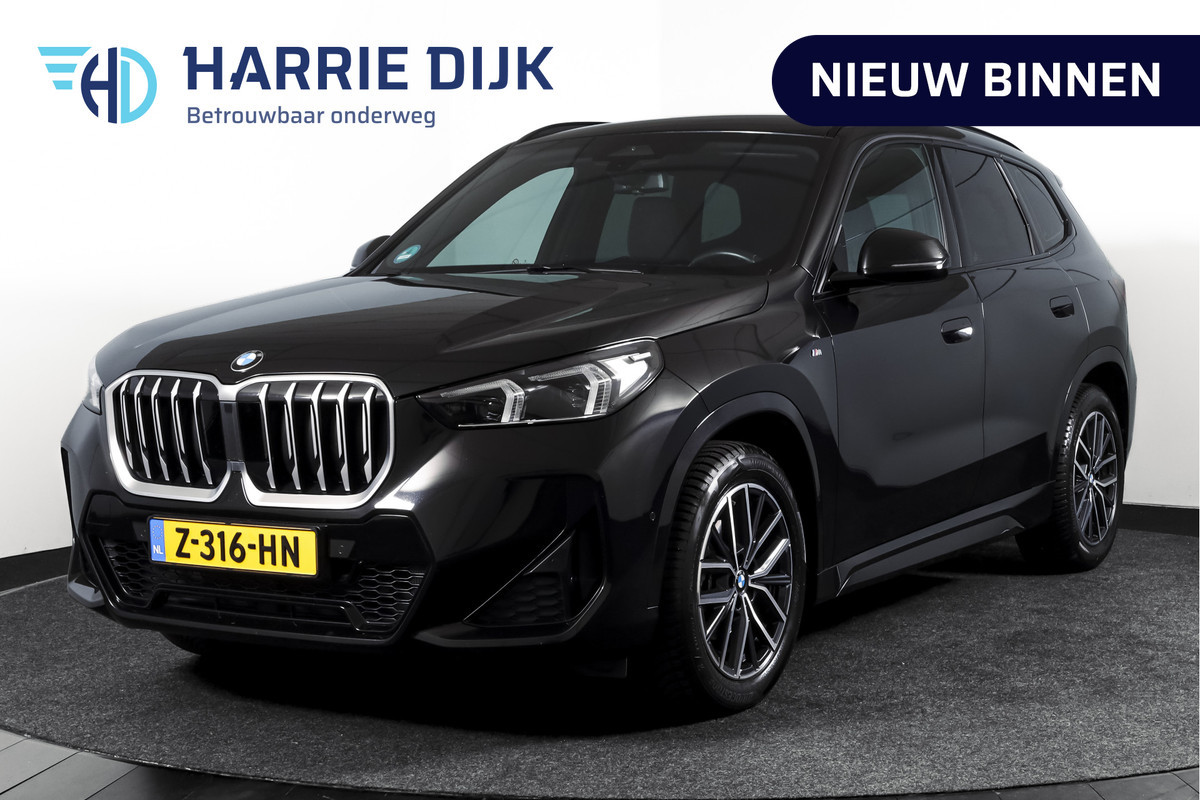 BMW X1 sDrive18i 136 PK | M-Sport | Afn. Trekhaak | Dig. Cockpit | Cruise | PDC | Camera | NAV + App. Connect | ECC | Elek. Klep | LM 18" |