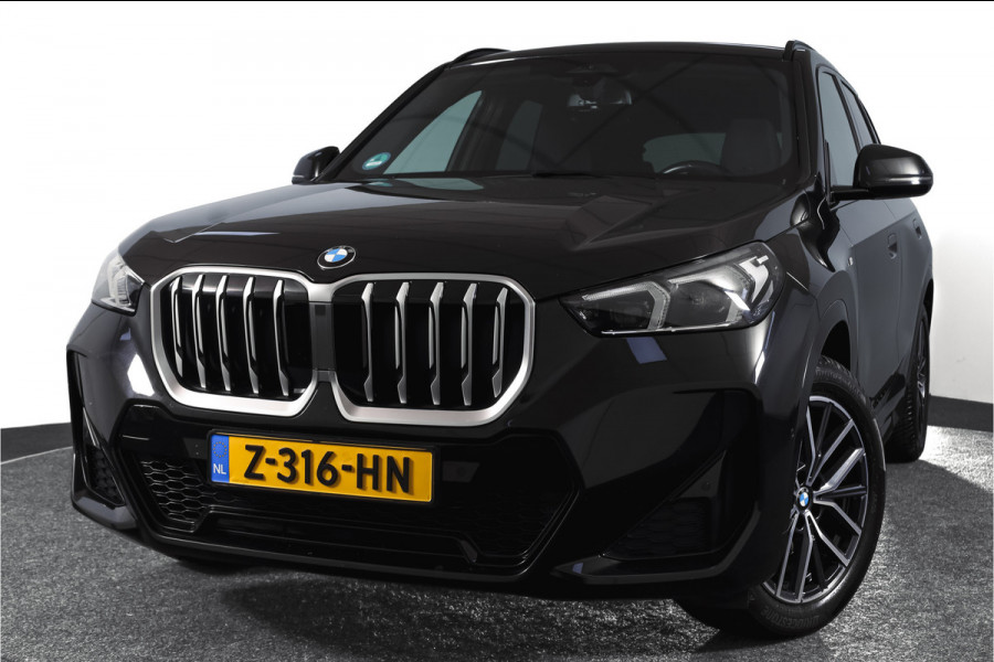 BMW X1 sDrive18i 136 PK | M-Sport | Afn. Trekhaak | Dig. Cockpit | Cruise | PDC | Camera | NAV + App. Connect | ECC | Elek. Klep | LM 18" |
