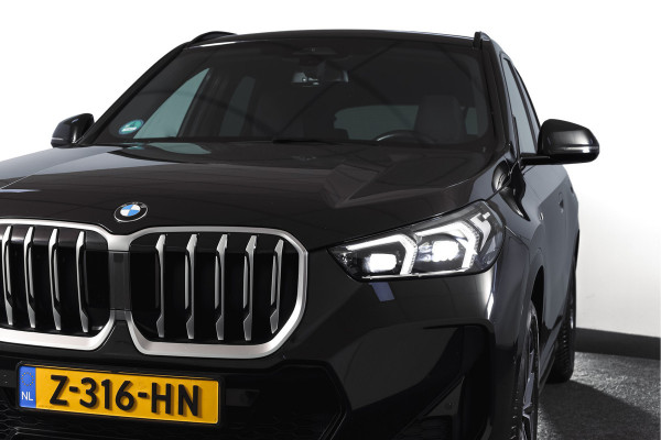 BMW X1 sDrive18i 136 PK | M-Sport | Afn. Trekhaak | Dig. Cockpit | Cruise | PDC | Camera | NAV + App. Connect | ECC | Elek. Klep | LM 18" |