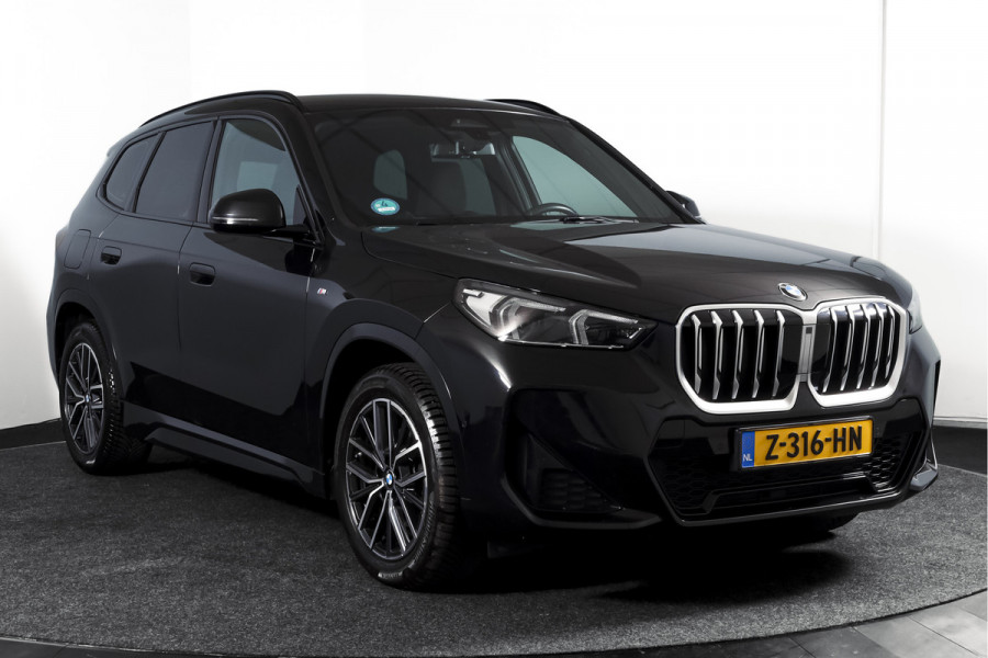 BMW X1 sDrive18i 136 PK | M-Sport | Afn. Trekhaak | Dig. Cockpit | Cruise | PDC | Camera | NAV + App. Connect | ECC | Elek. Klep | LM 18" |