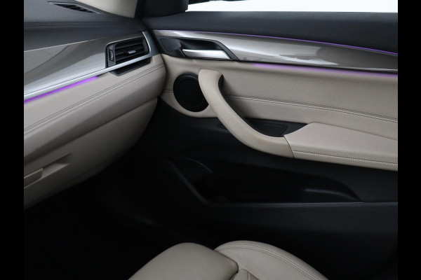 BMW X1 xDrive25e Business Edition Plus | SOH 91,4% | Panoramadak | Leder | Stoelverwarming | Sfeerverlichting | Cruise control | Navigatie | Park assist | PHEV