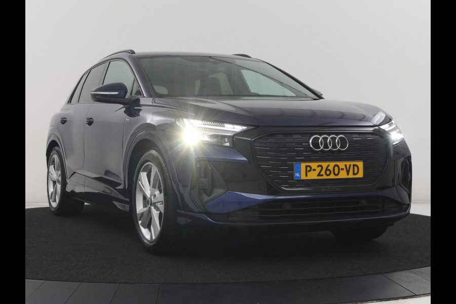 Audi Q4 e-tron 40 Launch edition S Competition 77 kWh | SOH 92,1% | Half leder | Stoelverwarming | Carplay | Adaptive cruise | Climate control | Camera | Park assist | Trekhaak