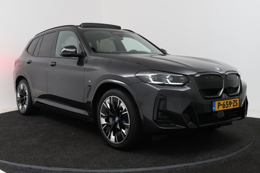BMW iX3 High Executive 80 kWh (PANORAMADAK, 360 CAMERA, SFEERVERLICHTING, ADAPTIVE CRUISE, TREKHAAK WEGKLAPBAAR, AUTOPILOT)