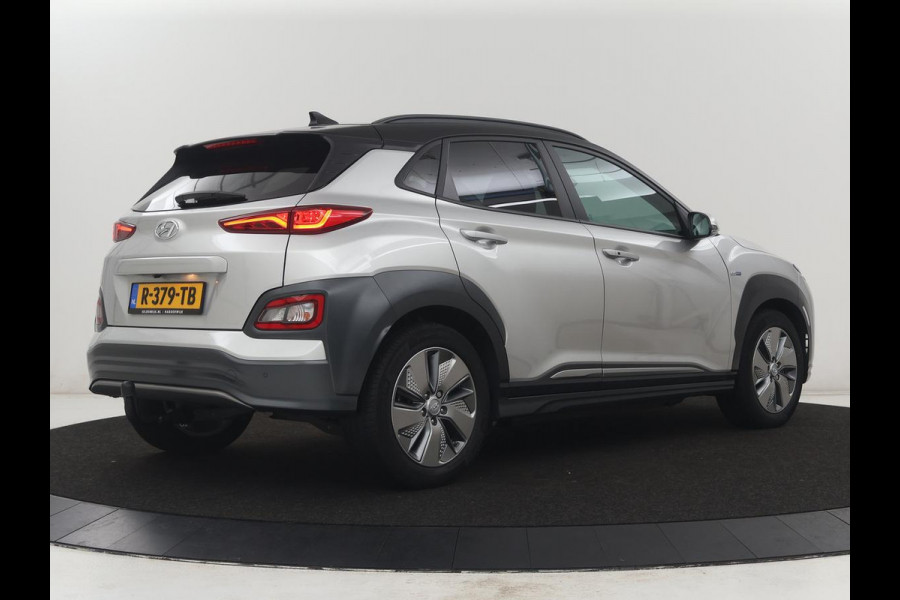 Hyundai Kona EV Fashion Design 64 kWh | SOH 94.6% | Leder | Head-up | Trekhaak | Adaptive cruise | Carplay | Stoelverwarming | Krell Sound | Dodehoek detectie |