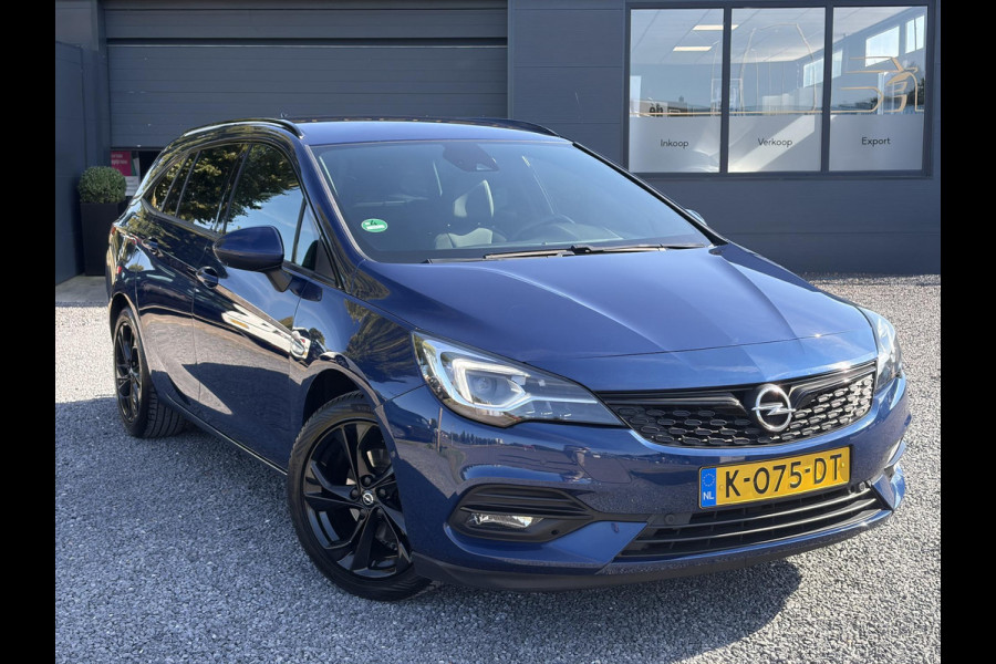 Opel Astra Sports Tourer 1.2 Ultimate 2e Eigenaar l Trekhaak l Camera l Carplay l Navi l Alcantara-Leder l 17''Lmv l Stoelverw-Stuurverw l Net beurt gehad l Dodehoek l Rijstrooksensor l Pdc V+A l 6 Bak l N.A.P l 146pk l Bj 11-2020 l Apk tot 08-2028