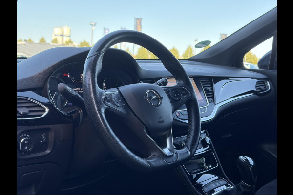 Opel Astra Sports Tourer 1.2 Ultimate 2e Eigenaar l Trekhaak l Camera l Carplay l Navi l Alcantara-Leder l 17''Lmv l Stoelverw-Stuurverw l Net beurt gehad l Dodehoek l Rijstrooksensor l Pdc V+A l 6 Bak l N.A.P l 146pk l Bj 11-2020 l Apk tot 08-2028