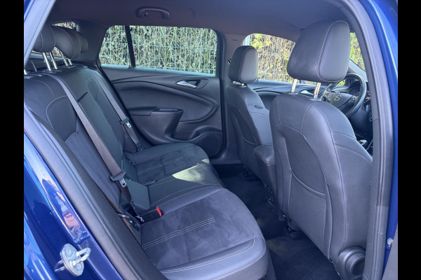 Opel Astra Sports Tourer 1.2 Ultimate 2e Eigenaar l Trekhaak l Camera l Carplay l Navi l Alcantara-Leder l 17''Lmv l Stoelverw-Stuurverw l Net beurt gehad l Dodehoek l Rijstrooksensor l Pdc V+A l 6 Bak l N.A.P l 146pk l Bj 11-2020 l Apk tot 08-2028