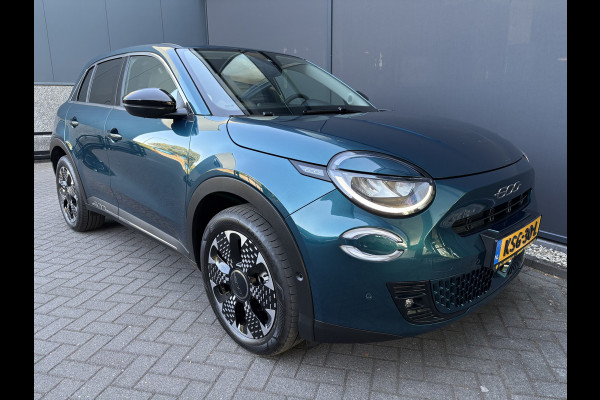Fiat 600E La Prima 54 kWh Achteruitrijcamera - Airco - Apple carplay - Parkeersensoren - Navigatie - Draadloze telefoonoplader - Stoelverwarming - Voorstoelen met massagefunctie - Led verlichting - Bluetooth - Cruise control - Dodehoek detectie - Keyless start/ entry - Licht metalen velgen 18 inch - Stuur multifunctioneel