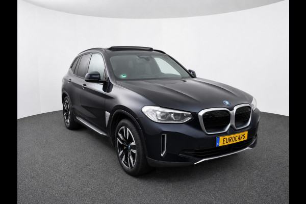 BMW iX3 High Executive Edition 80 kWh SOH 98,6% Panoramadak Trekhaak Navigatie Apple CarPlay Android Auto Camera Parkeerhulp Adaptive Cruise Control Stoelverwarming Full Led Leder Climate Control Lichtmetalen velgen