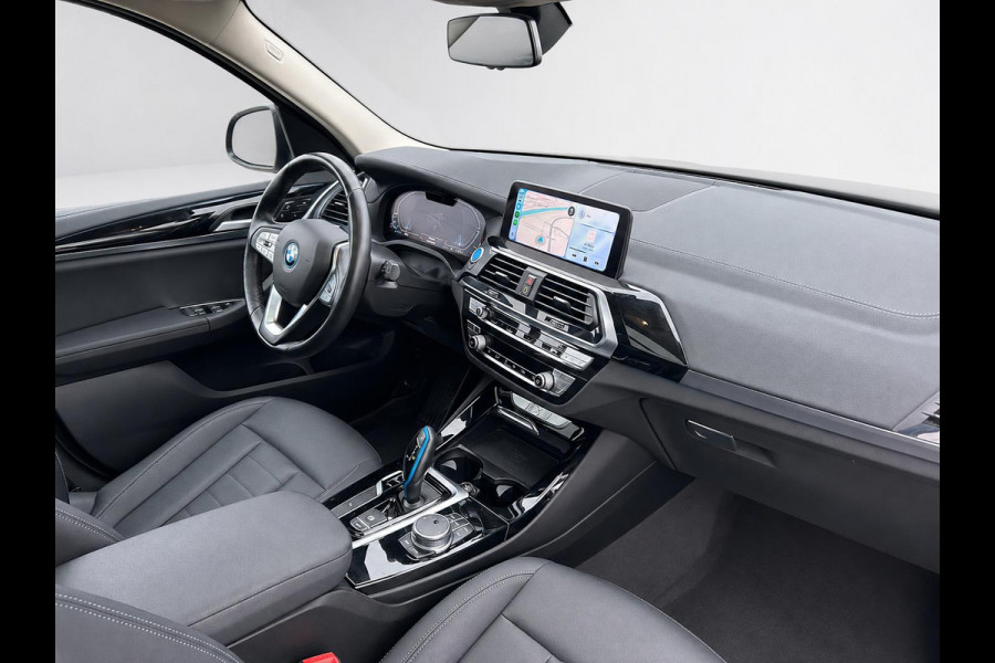 BMW iX3 High Executive Edition 80 kWh SOH 98,6% Panoramadak Trekhaak Navigatie Apple CarPlay Android Auto Camera Parkeerhulp Adaptive Cruise Control Stoelverwarming Full Led Leder Climate Control Lichtmetalen velgen