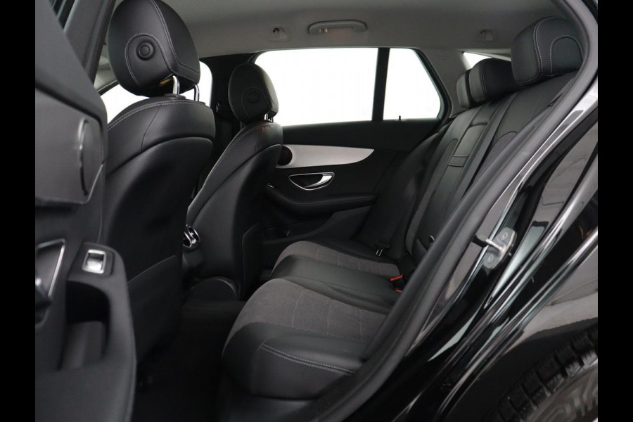 Mercedes-Benz C-Klasse Estate 180 Business Solution | Half leder | Stoelverwarming | Navigatie | Bluetooth | Camera | Park assist | Cruise control | Climate control | Elektrische achterklep | Trekhaak
