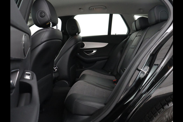 Mercedes-Benz C-Klasse Estate 180 Business Solution | Half leder | Stoelverwarming | Navigatie | Bluetooth | Camera | Park assist | Cruise control | Climate control | Elektrische achterklep | Trekhaak