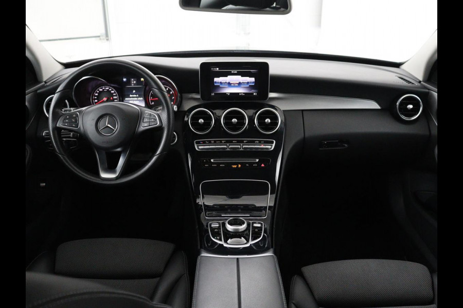 Mercedes-Benz C-Klasse Estate 180 Business Solution | Half leder | Stoelverwarming | Navigatie | Bluetooth | Camera | Park assist | Cruise control | Climate control | Elektrische achterklep | Trekhaak