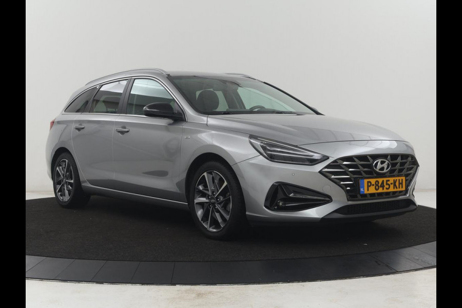 Hyundai i30 Wagon 1.5 T-GDi MHEV Premium | Leder | Stuur/stoel verwarming | Stoel ventilatie | Cruise control | Lane assist | Camera | Park assist | Climate control | Trekhaak