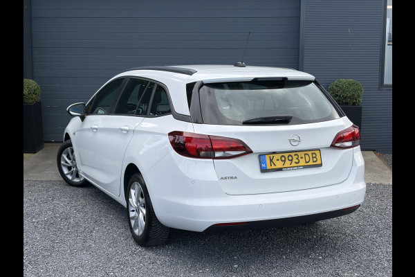 Opel Astra Sports Tourer 1.2 Edition ✓Camera ✓110pk✓2e Eigenaar✓Carplay✓Navi✓Airco✓Cruise✓Pdc✓LED koplampen✓N.A.P.✓6 Bak✓Pdc V+A✓Lm velgen✓Dakdragers ✓Comfortstoelen✓Bj 11-2020✓Apk tot 07-2028