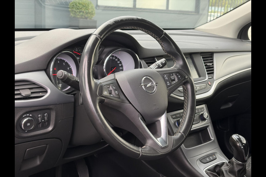Opel Astra Sports Tourer 1.2 Edition ✓2e Eigenaar✓Trekhaak✓131pk✓Navi✓Airco✓Cruise✓Pdc V+A✓Lm velgen✓Dealer Onderhouden✓Comfortstoelen✓N.A.P✓Apk tot 07-2028