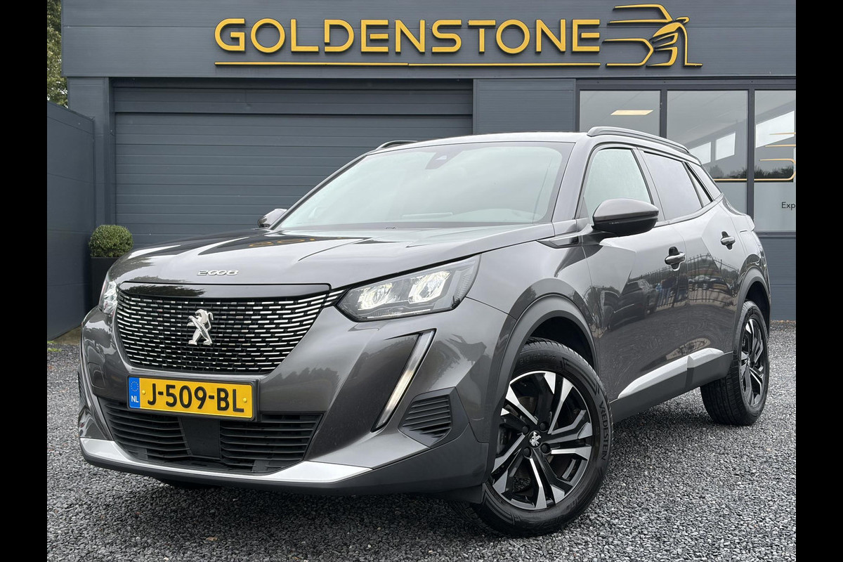 Peugeot 2008 1.2 PureTech Allure 2e Eigenaar l D-riem vv in 08/2024 l Camera 360° l Draadloze telefoonlader l 131pk l Carplay l Navi l 6 Bak l Clima l Cruise l Halfleder l Keylss l 17'' Lmv l Pdc l N.A.P l Apk tot 09-2028