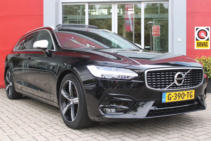 Volvo V90 2.0 T4 210PK R-DESIGN POLESTAR ENGINEERD | LUXURY LINE - PANORAMISCH SCHUIF/KANTEL DAK/HEAD-UP DISPLAY/PARK ASSIST CAMERA ACHTER/MET LEER BEKLEED DASHBOARD | PREMIUM AUDIO BY HARMAN KARDON PREMIUM AUDIO | R-DESIGN GEPERFOREERD NAPPA LEDEREN BEKLEDING MET CONTOURSTOELEN (SPORTSTOELEN) MET VERSTELBARE ZITVERLENGING | POWERSEATS -ELEKTRISCH VERSTELBARE VOORSTOELEN MET GEHEUGEN FUNCTIE OP BEIDE STOELEN | SCANDINAVIAN LINE - PARKEERVERWARMING MET TIMER (STANDKACHEL) / STOEL & STUUR VERWARMING / ACHTERBANK VERWARMING | ADAPTIVE CRUISECONTROL MET PILOT ASSIST | FULL LED KOPLA