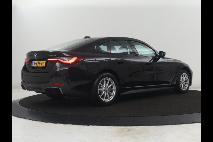 BMW i4 eDrive40 High Executive 84 kWh | SOH 98,7% | Leder | Adaptive cruise | Dodehoek detectie | Head-up | Stoelverwarming | Sfeerverlichting | Carplay | 3 zone klimaat | Camera | Park assist | Elektrische achterklep