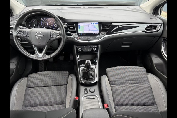 Opel Astra Sports Tourer 1.2 Elegance ✓131pk✓2e Eigenaar✓Camera✓Carplay✓6 Bak✓Stoelverw✓Stuurverw✓Pdc V+A✓Recent beurt gehad✓Clima✓Cruise✓Halfleder✓Keyless✓N.A.P✓Lm velgen✓Rijstrooksensor✓Apk tot 09-2028
