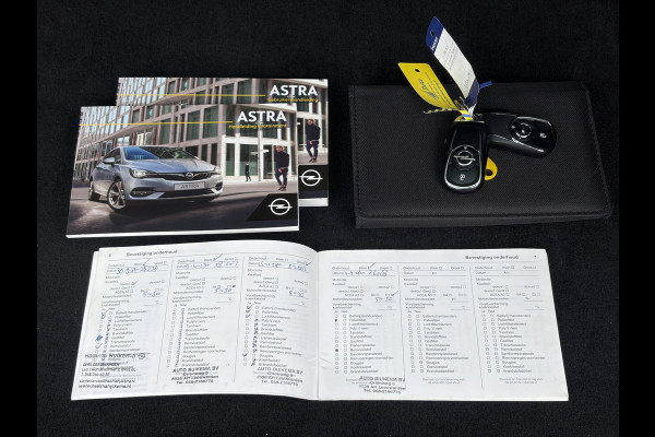 Opel Astra Sports Tourer 1.2 Elegance ✓131pk✓2e Eigenaar✓Camera✓Carplay✓6 Bak✓Stoelverw✓Stuurverw✓Pdc V+A✓Recent beurt gehad✓Clima✓Cruise✓Halfleder✓Keyless✓N.A.P✓Lm velgen✓Rijstrooksensor✓Apk tot 09-2028