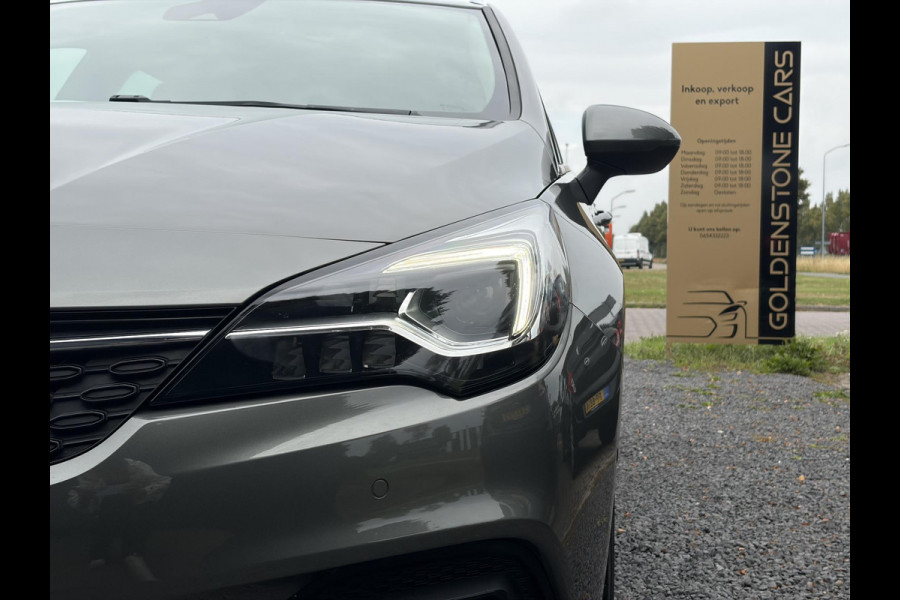 Opel Astra Sports Tourer 1.2 Elegance ✓131pk✓2e Eigenaar✓Camera✓Carplay✓6 Bak✓Stoelverw✓Stuurverw✓Pdc V+A✓Recent beurt gehad✓Clima✓Cruise✓Halfleder✓Keyless✓N.A.P✓Lm velgen✓Rijstrooksensor✓Apk tot 09-2028