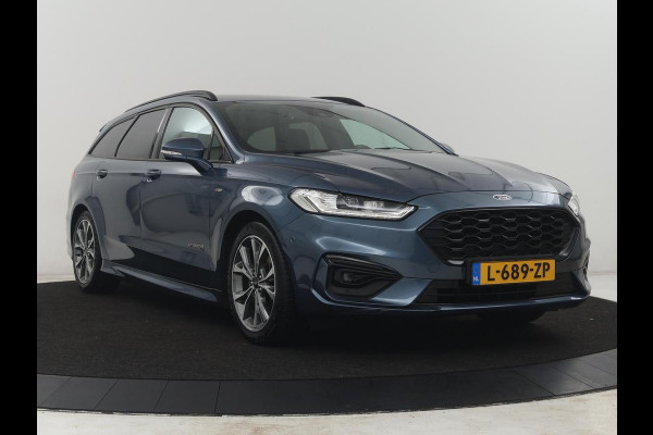 Ford Mondeo Wagon 2.0 IVCT HEV Vignale | Leder/alcantara | Memory | Cruise control | Dodehoek detectie | Stuur/stoel verwarming | Achterbank verwarming | Carplay | Camera | Park assist | Elektrische achterklep