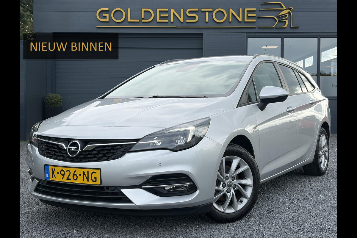 Opel Astra Sports Tourer 1.2 Business Executive ✓1e Eigenaar✓146pk✓Camera✓Trekhaak✓Carplay✓Airco✓Cruise✓Pdc V+A✓Lm velgen✓Comfortstoelen✓6 Bak✓N.A.P✓Nieuwe Apk bij Aflevering