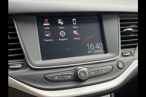 Opel Astra Sports Tourer 1.2 Business Executive ✓1e Eigenaar✓146pk✓Camera✓Trekhaak✓Carplay✓Airco✓Cruise✓Pdc V+A✓Lm velgen✓Comfortstoelen✓6 Bak✓N.A.P✓Nieuwe Apk bij Aflevering