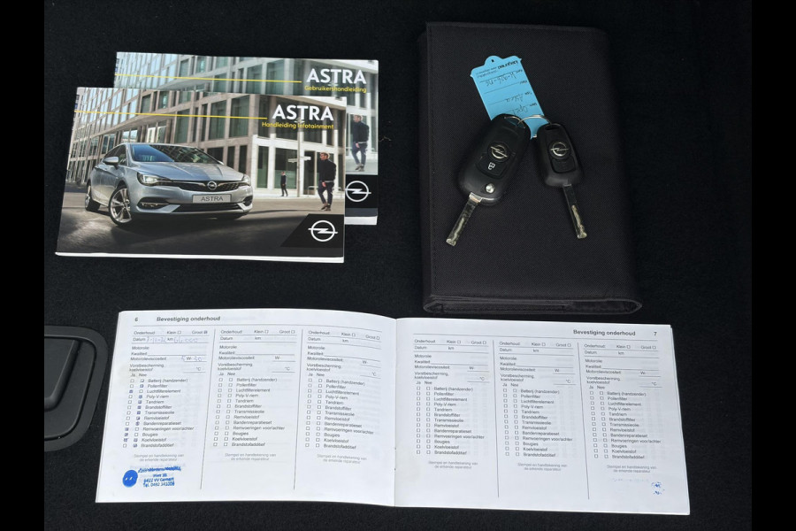 Opel Astra Sports Tourer 1.2 Business Executive ✓1e Eigenaar✓146pk✓Camera✓Trekhaak✓Carplay✓Airco✓Cruise✓Pdc V+A✓Lm velgen✓Comfortstoelen✓6 Bak✓N.A.P✓Nieuwe Apk bij Aflevering