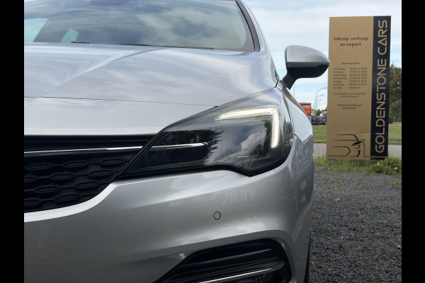 Opel Astra Sports Tourer 1.2 Business Executive ✓1e Eigenaar✓146pk✓Camera✓Trekhaak✓Carplay✓Airco✓Cruise✓Pdc V+A✓Lm velgen✓Comfortstoelen✓6 Bak✓N.A.P✓Nieuwe Apk bij Aflevering