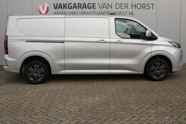 Ford E-Transit Custom 340 L2H1 Limited 71 kWh. Vol elektrisch ! De nieuwe E-Transit Custom is klaar voor de toekomst ! Airco, navigatie, telefoonvoorb., 17" LM wln (meerprijs), 3-zits, camera, parkeersensoren, LED verl., stoel-, stuur-, spiegel- en voorraamverwarming etc.