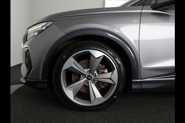Audi Q4 Sportback e-tron 40 S edition 77 kWh 204 pk | Navigatie | Warmtepomp | Panoramadak | Parkeersensoren | Achteruitrijcamera | Lederen bekleding | Lichtmetalen velgen 21" | SONOS soundsystem | S-Line |
