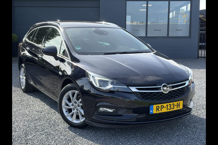 Opel Astra Sports Tourer 1.4 Business Executive ✓2 Eigenaar✓Camera✓Navi✓Trekhaakt✓Carplay✓Stoelverw✓Stuurverw✓Automaat✓Dealer Onderhouden✓Keyless✓Clima✓Cruise✓Pdc V+A✓Halfleder✓Comfortstoelen✓150pk✓Rijstrooksensor✓Dodehoeksensor✓Elekt Stoelen✓Lm velgen✓N.A.P✓Apk tot 03-2027