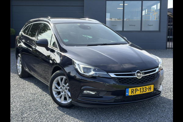 Opel Astra Sports Tourer 1.4 Business Executive ✓2 Eigenaar✓Camera✓Navi✓Trekhaakt✓Carplay✓Stoelverw✓Stuurverw✓Automaat✓Dealer Onderhouden✓Keyless✓Clima✓Cruise✓Pdc V+A✓Halfleder✓Comfortstoelen✓150pk✓Rijstrooksensor✓Dodehoeksensor✓Elekt Stoelen✓Lm velgen✓N.A.P✓Apk tot 03-2027