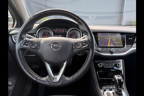 Opel Astra Sports Tourer 1.4 Business Executive ✓2 Eigenaar✓Camera✓Navi✓Trekhaakt✓Carplay✓Stoelverw✓Stuurverw✓Automaat✓Dealer Onderhouden✓Keyless✓Clima✓Cruise✓Pdc V+A✓Halfleder✓Comfortstoelen✓150pk✓Rijstrooksensor✓Dodehoeksensor✓Elekt Stoelen✓Lm velgen✓N.A.P✓Apk tot 03-2027
