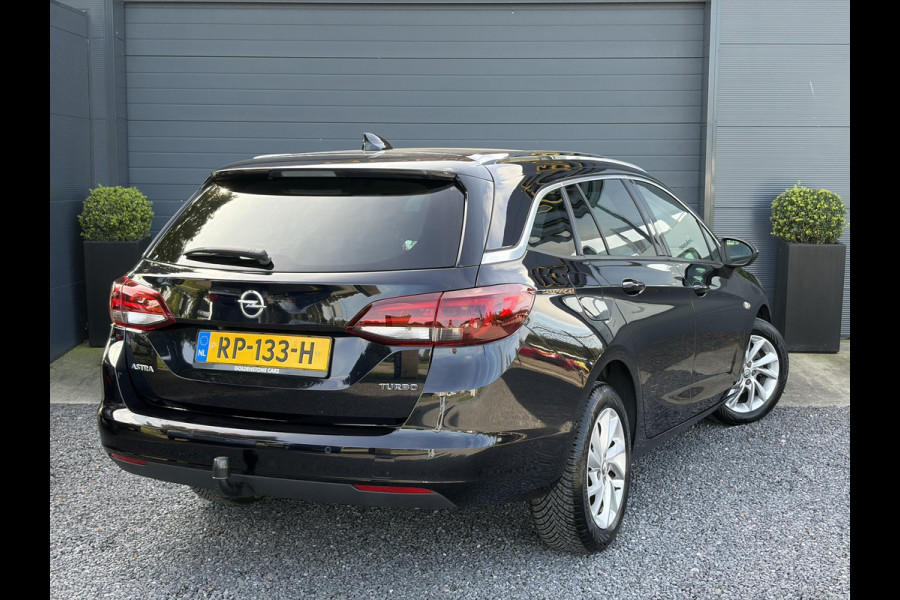 Opel Astra Sports Tourer 1.4 Business Executive ✓2 Eigenaar✓Camera✓Navi✓Trekhaakt✓Carplay✓Stoelverw✓Stuurverw✓Automaat✓Dealer Onderhouden✓Keyless✓Clima✓Cruise✓Pdc V+A✓Halfleder✓Comfortstoelen✓150pk✓Rijstrooksensor✓Dodehoeksensor✓Elekt Stoelen✓Lm velgen✓N.A.P✓Apk tot 03-2027