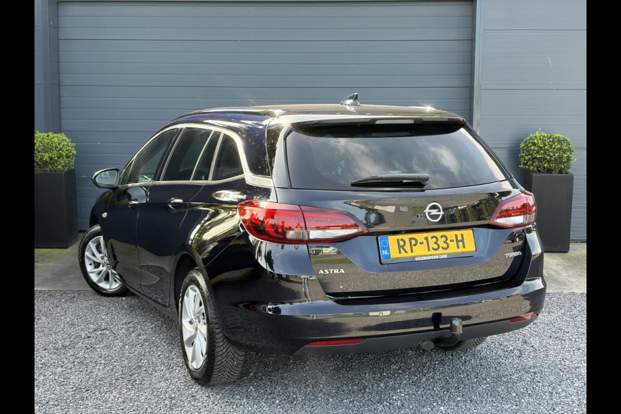 Opel Astra Sports Tourer 1.4 Business Executive ✓2 Eigenaar✓Camera✓Navi✓Trekhaakt✓Carplay✓Stoelverw✓Stuurverw✓Automaat✓Dealer Onderhouden✓Keyless✓Clima✓Cruise✓Pdc V+A✓Halfleder✓Comfortstoelen✓150pk✓Rijstrooksensor✓Dodehoeksensor✓Elekt Stoelen✓Lm velgen✓N.A.P✓Apk tot 03-2027