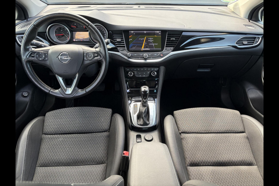 Opel Astra Sports Tourer 1.4 Business Executive ✓2 Eigenaar✓Camera✓Navi✓Trekhaakt✓Carplay✓Stoelverw✓Stuurverw✓Automaat✓Dealer Onderhouden✓Keyless✓Clima✓Cruise✓Pdc V+A✓Halfleder✓Comfortstoelen✓150pk✓Rijstrooksensor✓Dodehoeksensor✓Elekt Stoelen✓Lm velgen✓N.A.P✓Apk tot 03-2027