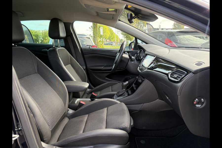 Opel Astra Sports Tourer 1.4 Business Executive ✓2 Eigenaar✓Camera✓Navi✓Trekhaakt✓Carplay✓Stoelverw✓Stuurverw✓Automaat✓Dealer Onderhouden✓Keyless✓Clima✓Cruise✓Pdc V+A✓Halfleder✓Comfortstoelen✓150pk✓Rijstrooksensor✓Dodehoeksensor✓Elekt Stoelen✓Lm velgen✓N.A.P✓Apk tot 03-2027