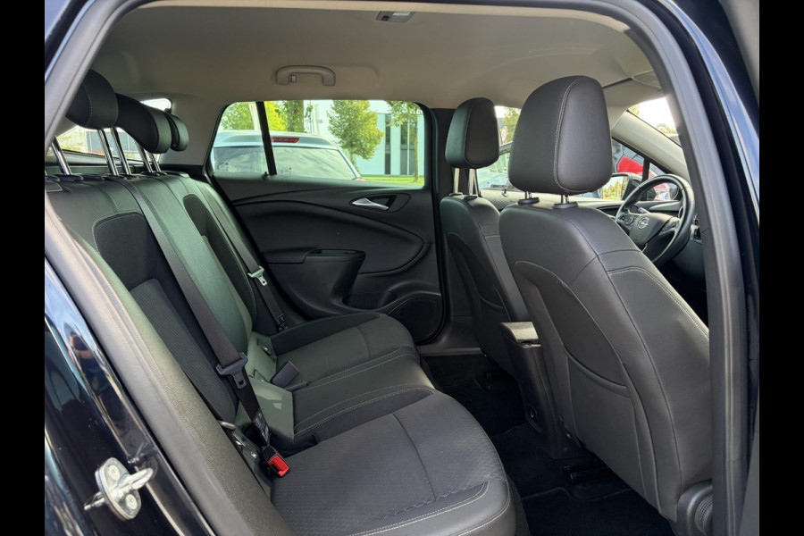 Opel Astra Sports Tourer 1.4 Business Executive ✓2 Eigenaar✓Camera✓Navi✓Trekhaakt✓Carplay✓Stoelverw✓Stuurverw✓Automaat✓Dealer Onderhouden✓Keyless✓Clima✓Cruise✓Pdc V+A✓Halfleder✓Comfortstoelen✓150pk✓Rijstrooksensor✓Dodehoeksensor✓Elekt Stoelen✓Lm velgen✓N.A.P✓Apk tot 03-2027