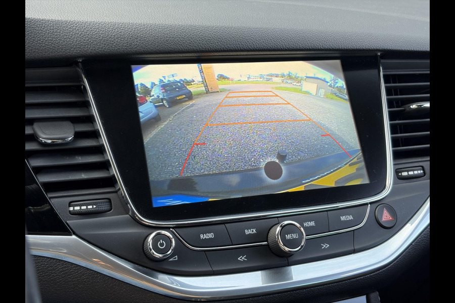 Opel Astra Sports Tourer 1.4 Business Executive ✓2 Eigenaar✓Camera✓Navi✓Trekhaakt✓Carplay✓Stoelverw✓Stuurverw✓Automaat✓Dealer Onderhouden✓Keyless✓Clima✓Cruise✓Pdc V+A✓Halfleder✓Comfortstoelen✓150pk✓Rijstrooksensor✓Dodehoeksensor✓Elekt Stoelen✓Lm velgen✓N.A.P✓Apk tot 03-2027