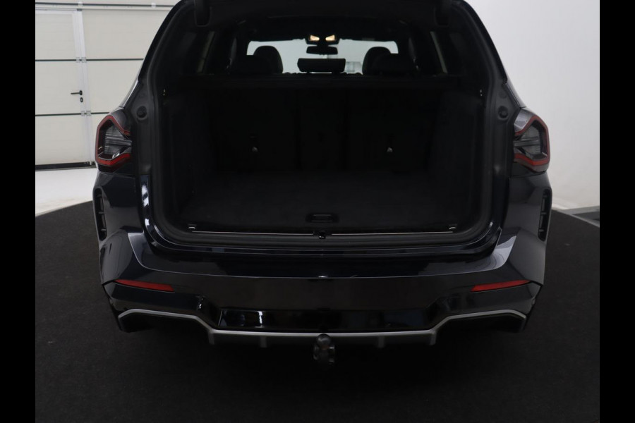 BMW iX3 Executive 80 kWh M-Sport | SOH 94.4% | Panoramadak | Leder | Adaptive cruise | Trekhaak | Carplay | Sfeerverlichting | Memory | Stuur/stoelverwarming | Camera | Park assist |