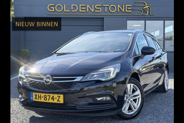 Opel Astra Sports Tourer 1.4 Turbo Online Edition ✓150pk✓2e Eigenaar✓Camera✓Carplay✓Navi✓Pdc V+A✓Stoelverw✓Stuurverw✓Clima✓Cruise✓Lm velgen✓6 Bak✓Comfortstoelen✓Dealer Onderhouden✓N.A.P✓Bj 12-2018✓Apk tot 01-2027