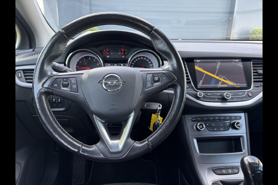 Opel Astra Sports Tourer 1.4 Turbo Online Edition ✓150pk✓2e Eigenaar✓Camera✓Carplay✓Navi✓Pdc V+A✓Stoelverw✓Stuurverw✓Clima✓Cruise✓Lm velgen✓6 Bak✓Comfortstoelen✓Dealer Onderhouden✓N.A.P✓Bj 12-2018✓Apk tot 01-2027