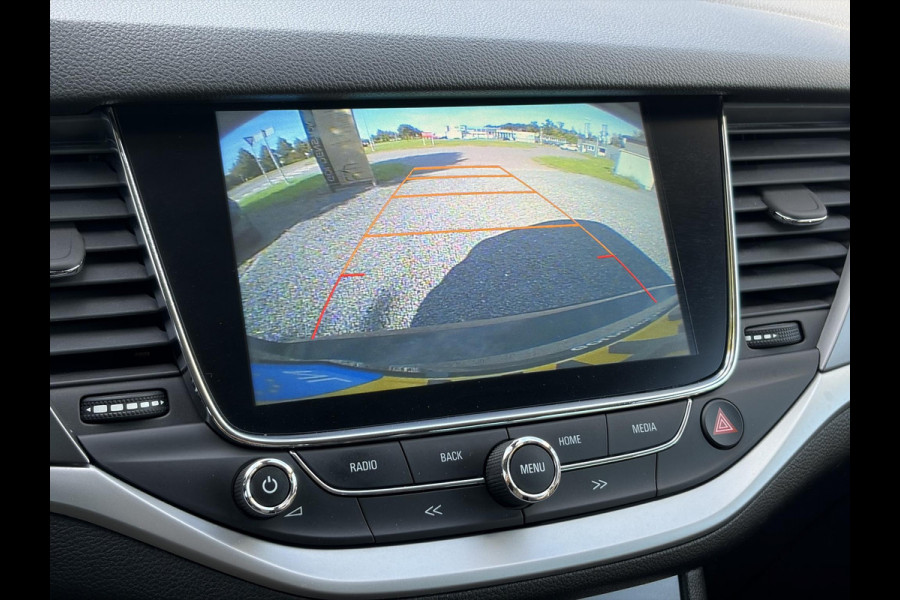 Opel Astra Sports Tourer 1.4 Turbo Online Edition ✓150pk✓2e Eigenaar✓Camera✓Carplay✓Navi✓Pdc V+A✓Stoelverw✓Stuurverw✓Clima✓Cruise✓Lm velgen✓6 Bak✓Comfortstoelen✓Dealer Onderhouden✓N.A.P✓Bj 12-2018✓Apk tot 01-2027