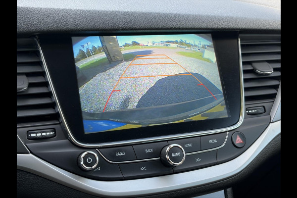 Opel Astra Sports Tourer 1.4 Turbo Online Edition ✓150pk✓2e Eigenaar✓Camera✓Carplay✓Navi✓Pdc V+A✓Stoelverw✓Stuurverw✓Clima✓Cruise✓Lm velgen✓6 Bak✓Comfortstoelen✓Dealer Onderhouden✓N.A.P✓Bj 12-2018✓Apk tot 01-2027
