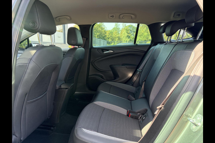 Opel Astra Sports Tourer 1.2 Business Elegance ✓1e Eigenaar✓110pk✓Carplay✓Camera✓Navi✓Clima✓Cruise✓Halfleder✓Comfortstoel✓Pdc V+A✓6 Bak✓Dealer Onderhouden✓Keyless✓Lm velgen✓N.A.P✓Apk tot 06-2027