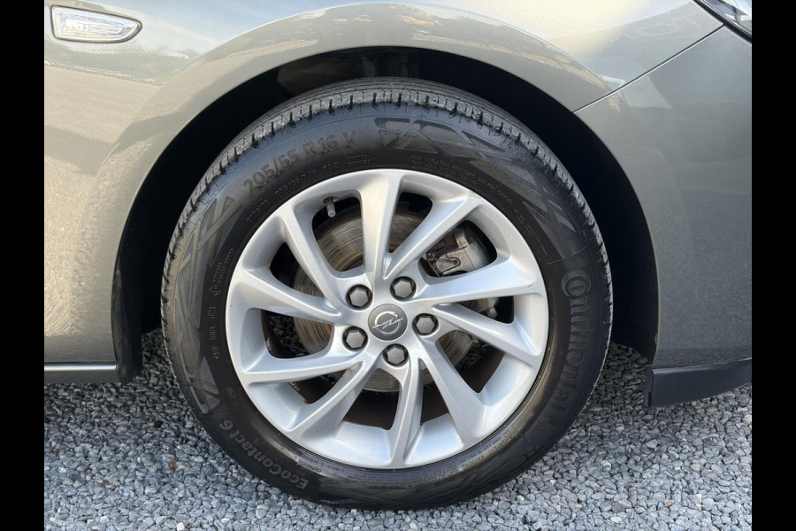 Opel Astra Sports Tourer 1.2 Business Elegance ✓1e Eigenaar✓110pk✓Carplay✓Camera✓Navi✓Clima✓Cruise✓Halfleder✓Comfortstoel✓Pdc V+A✓6 Bak✓Dealer Onderhouden✓Keyless✓Lm velgen✓N.A.P✓Apk tot 06-2027
